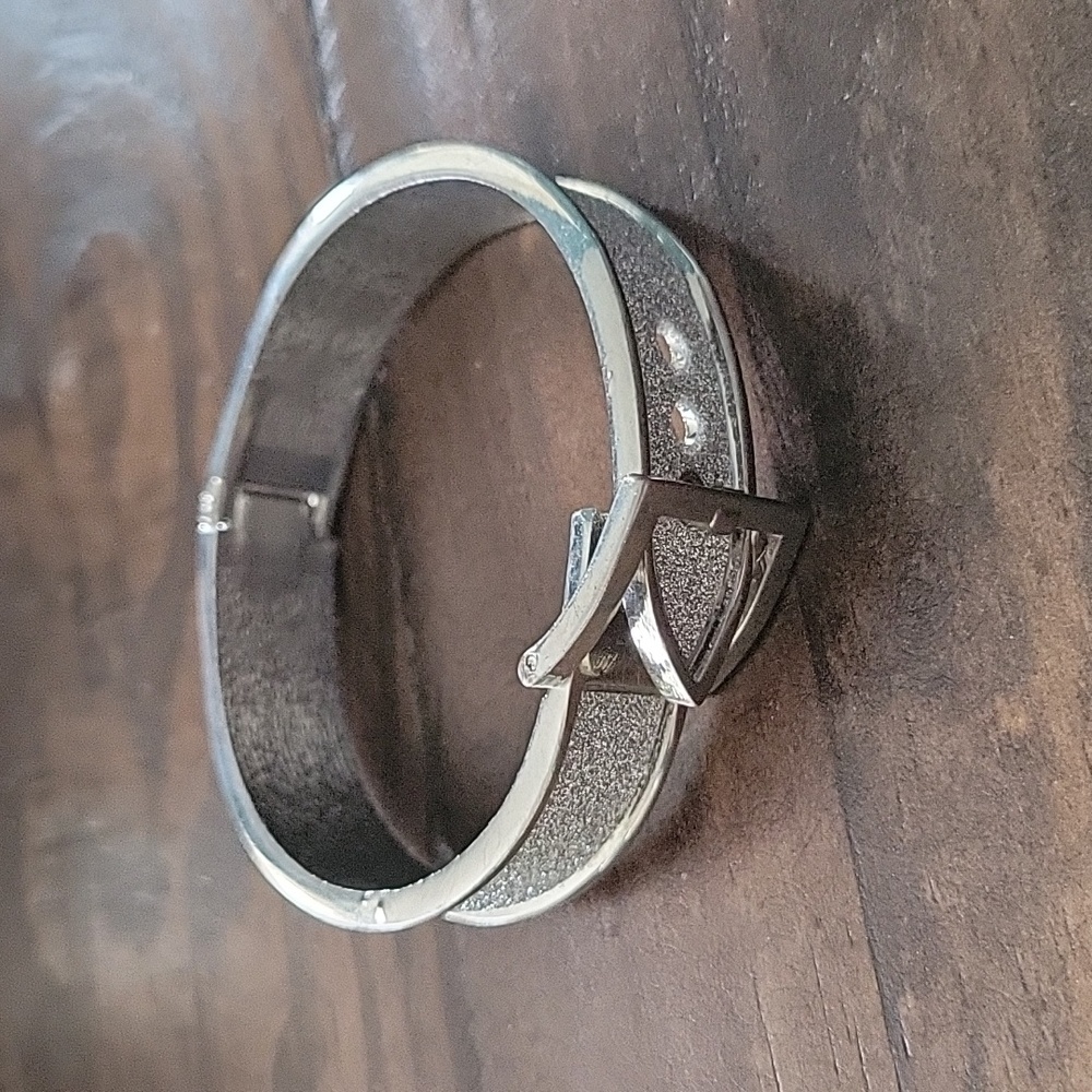 Silver tone buckle bracelet with faux chrystal paving